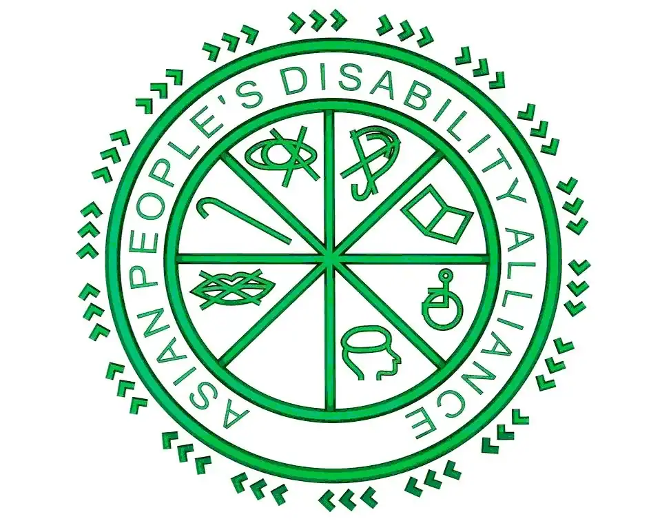 Green circular logo of the Asian People’s Disability Alliance, featuring eight disability symbols within a wheel, surrounded by the organization’s name and decorative arrows.